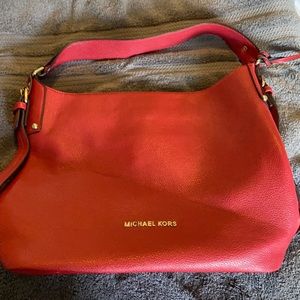 Red leather Michael Kors shoulder bag.